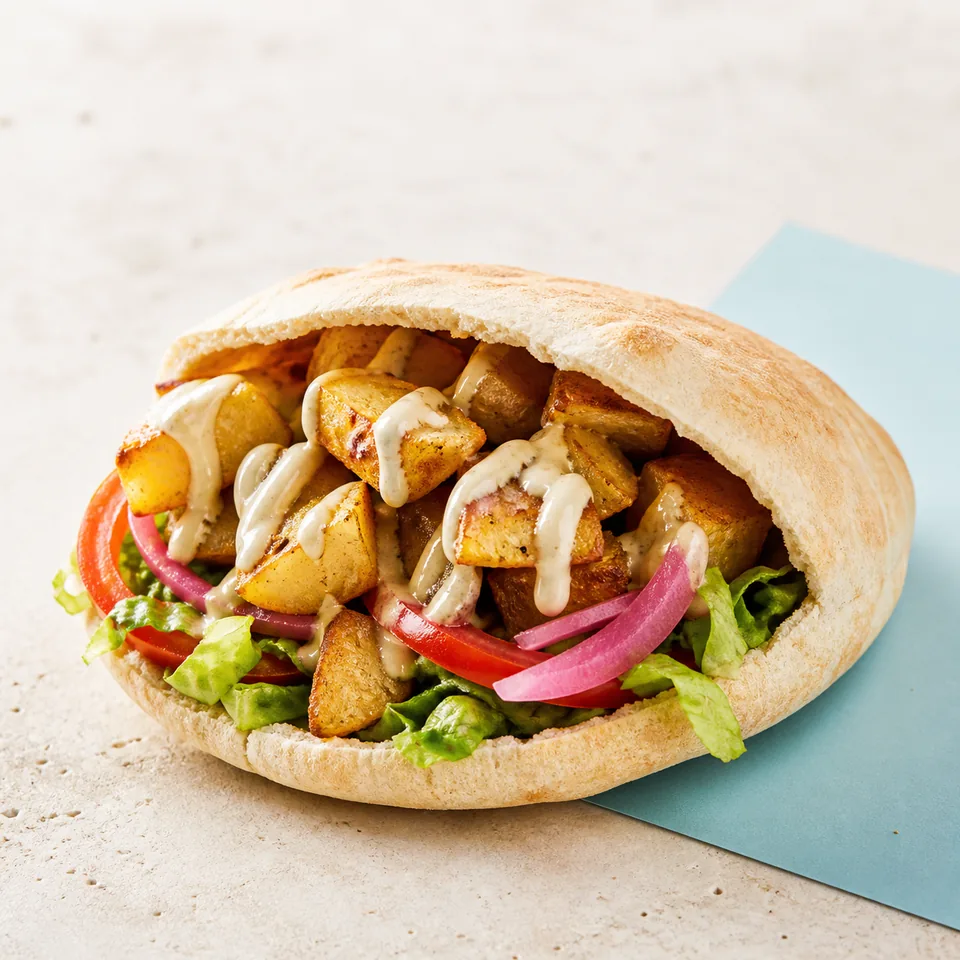 Loaded potato pita prepared for pickup